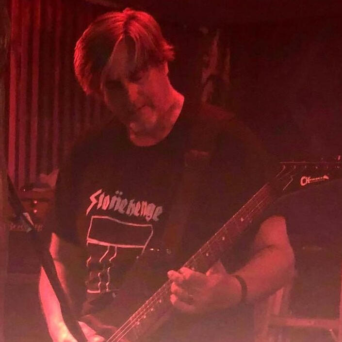 Steve Silverfoxfit Steve from Silverfoxfit & Stringshock playing electric guitar at a concert